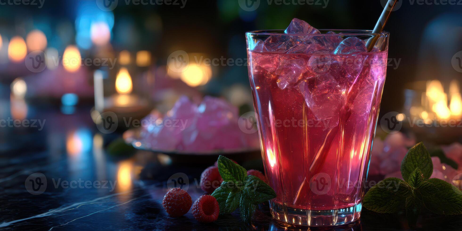 Refreshing raspberry drink with ice served at a cozy evening gathering photo