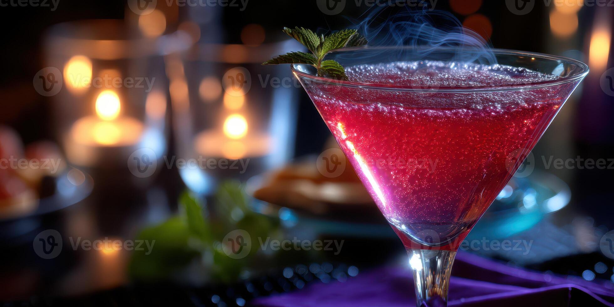 Colorful cocktail with mint garnish served at a dimly lit bar setting during a social gathering photo