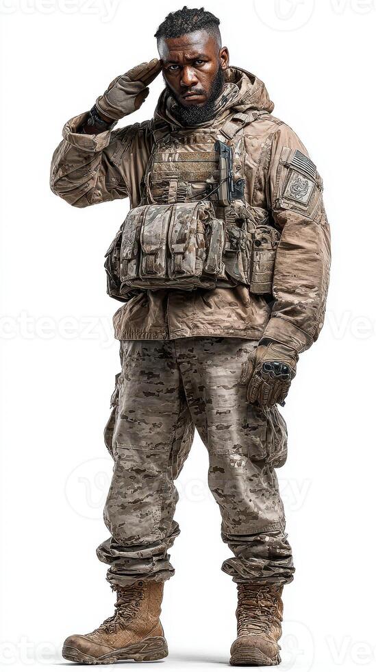 Military soldier salutes in tactical gear against a plain background during a training exercise photo