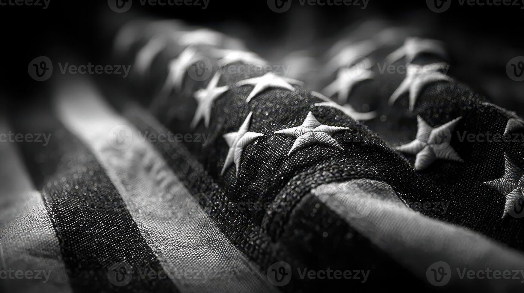 U.S. flag displayed with intricate stitching and stars, capturing an emblem of national pride in monochrome tones photo