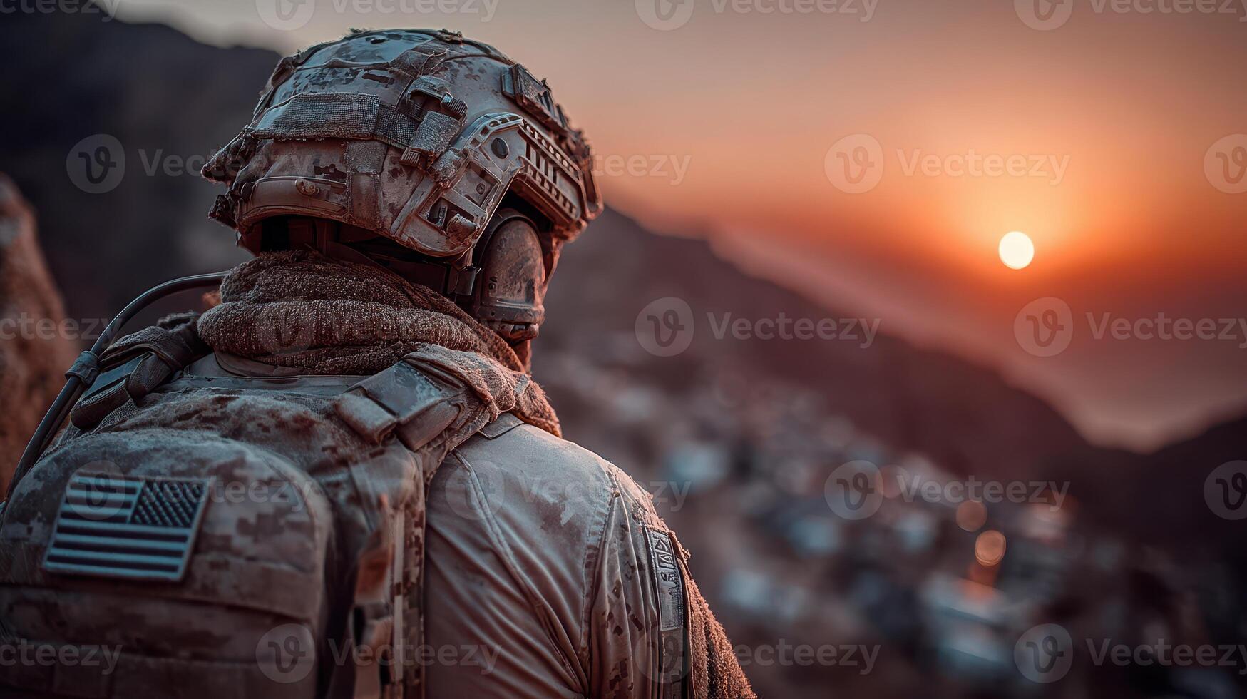 Soldier observing sunset over distant hills, reflecting on duty and sacrifice near military base photo