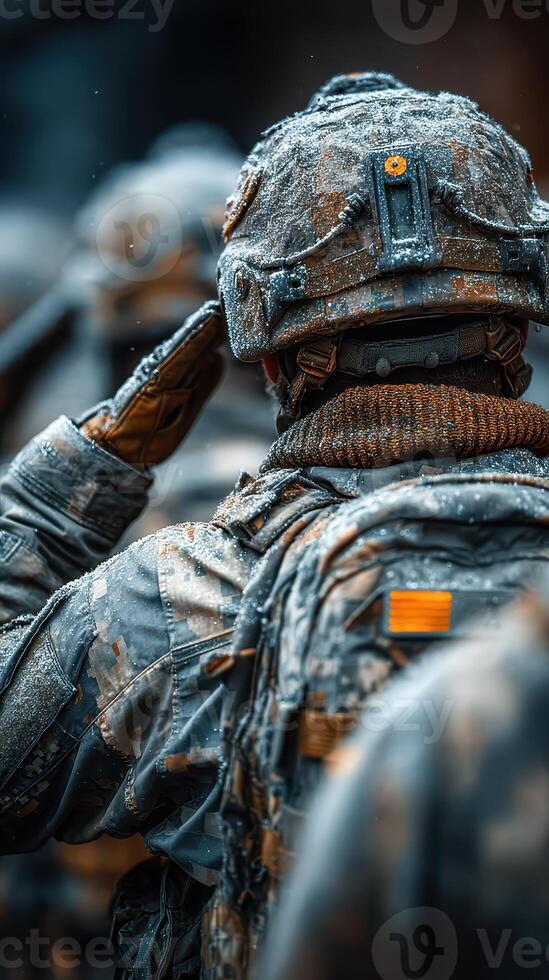 Soldiers salute in snowy environment during a military training exercise in winter conditions in the mountains photo