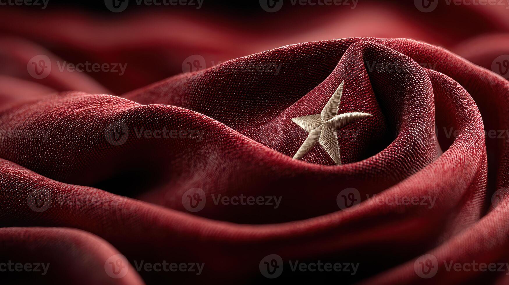Red fabric with a star emblem symbolizes national pride and identity, showcasing intricate texture and deep color photo