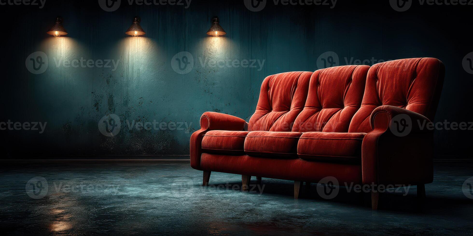 Vintage red sofa in a dimly lit room with industrial style lighting creating a moody atmosphere photo