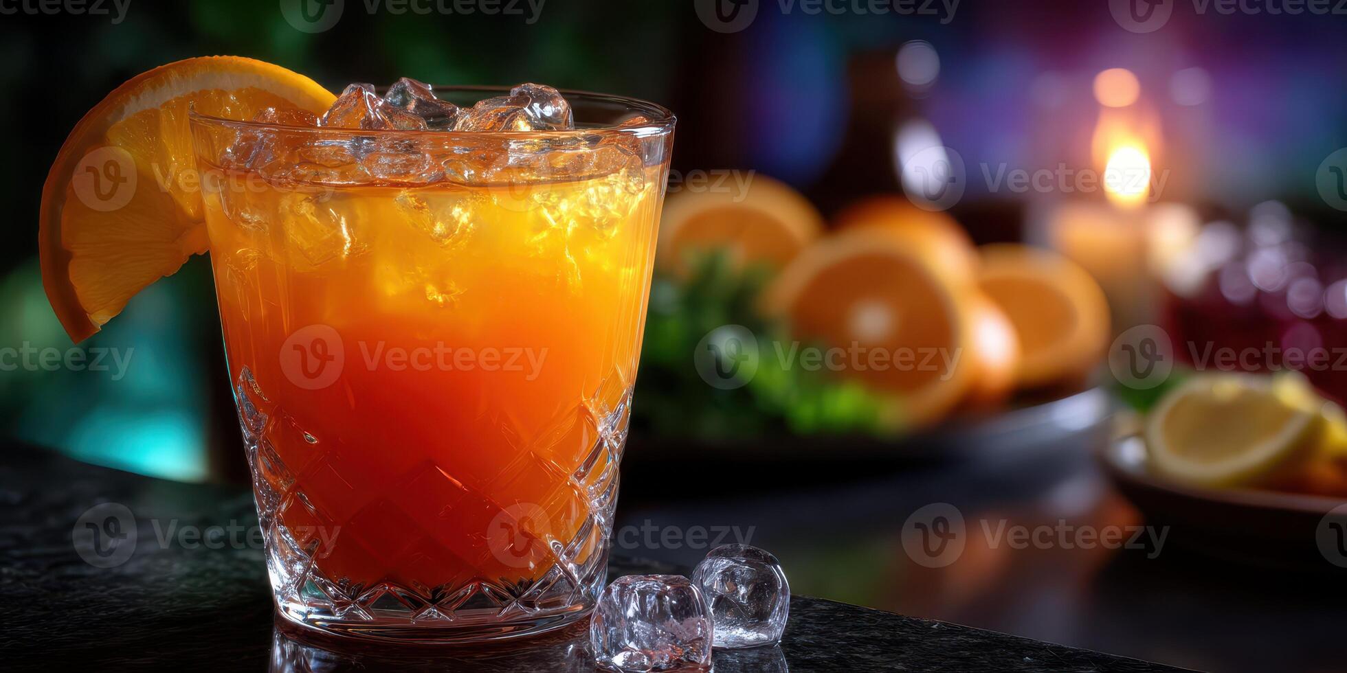 Refreshing citrus cocktail served in a crystal glass with ice in a cozy bar setting at night photo