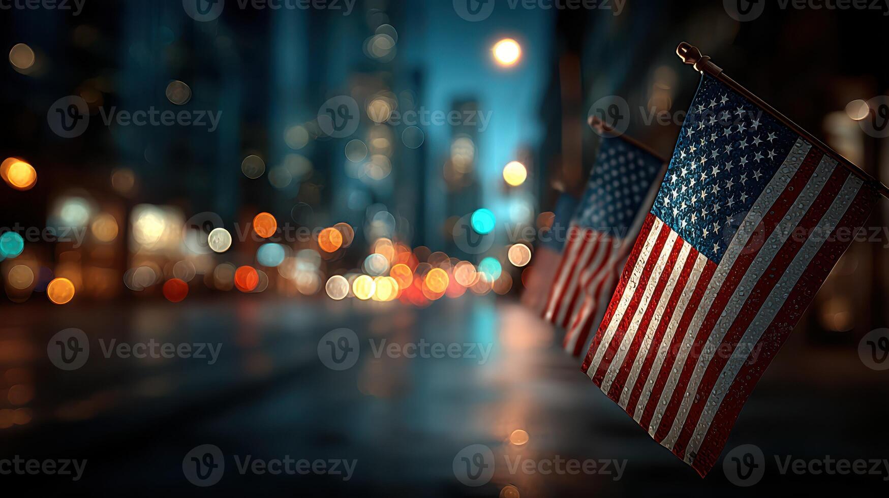 Flags waving in the city at night with blurred lights and reflections on the wet street photo