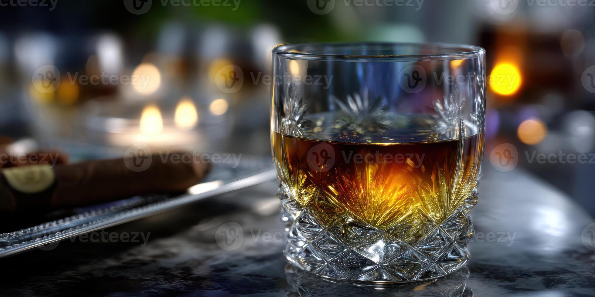 Whiskey served in a crystal glass by candlelight with cigars on a table in an elegant setting at night photo