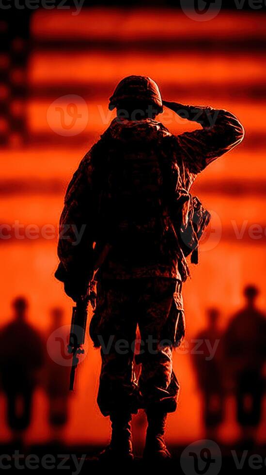 Military soldier saluting against a dramatic backdrop of an American flag during a ceremony at sunset photo