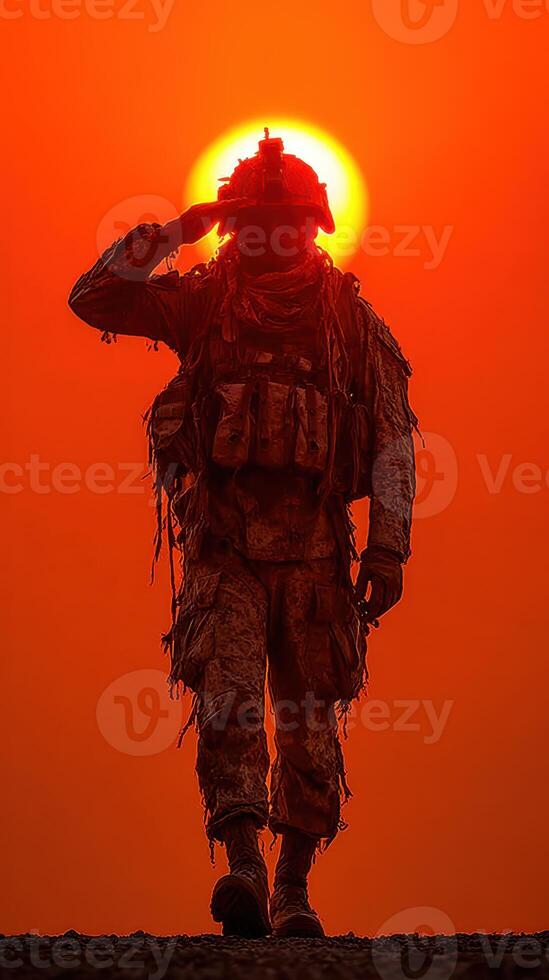 Soldier saluting against dramatic sunset backdrop on military mission photo