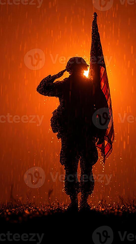 Soldier saluting in the rain with an American flag against a dramatic orange backdrop photo