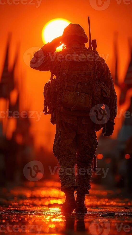 Soldier saluting at sunset during military ceremony with flags in background photo