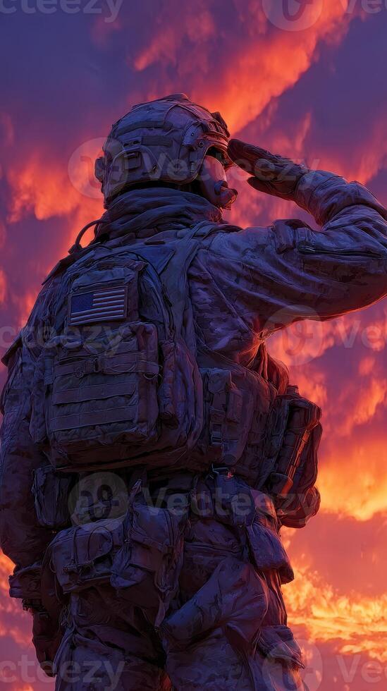 Soldier saluting against a vibrant sunset sky in a display of respect and honor photo