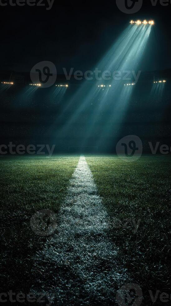Bright stadium lights illuminate a football field in anticipation of an exciting match at night photo