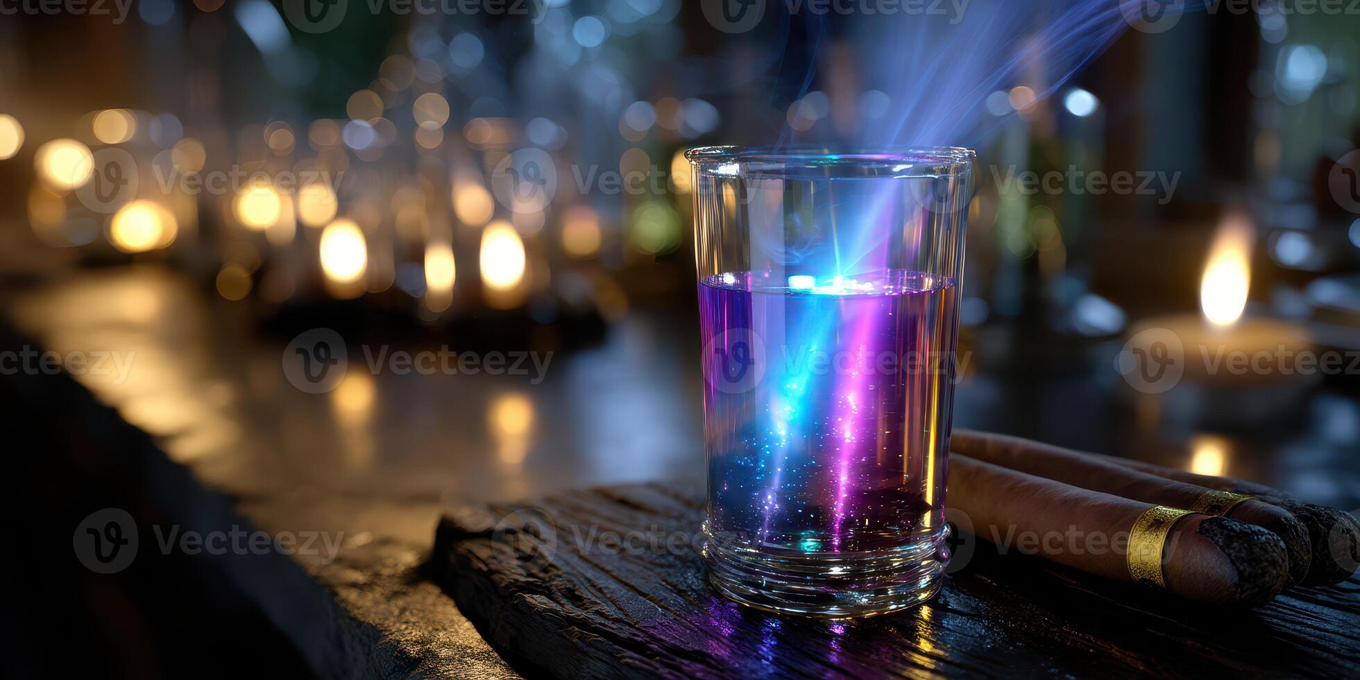 Colorful potion glows mysteriously in darkened room filled with candlelight photo