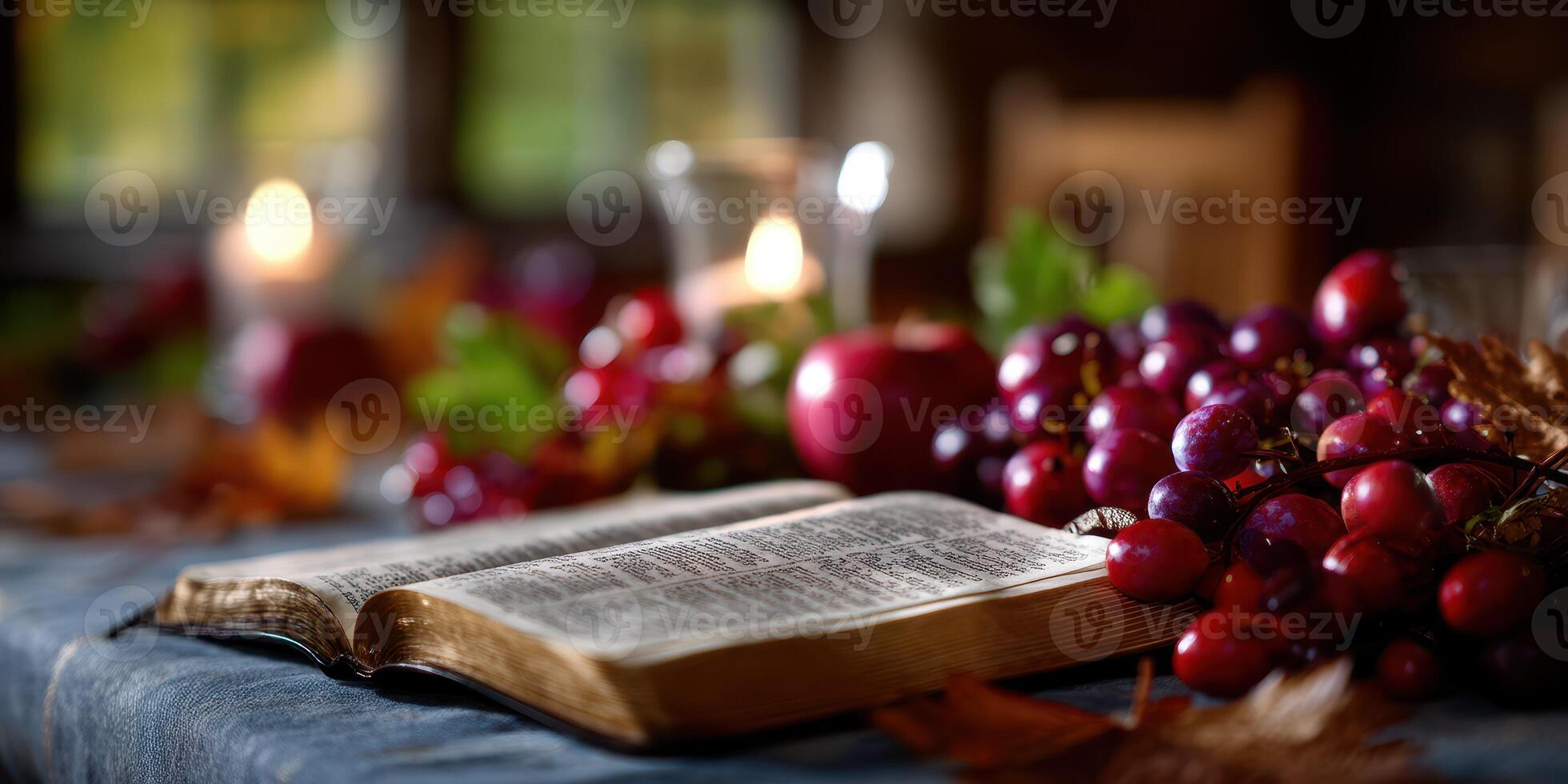 Beautiful arrangement of fruits and open book on a rustic table with candles during autumn evening photo