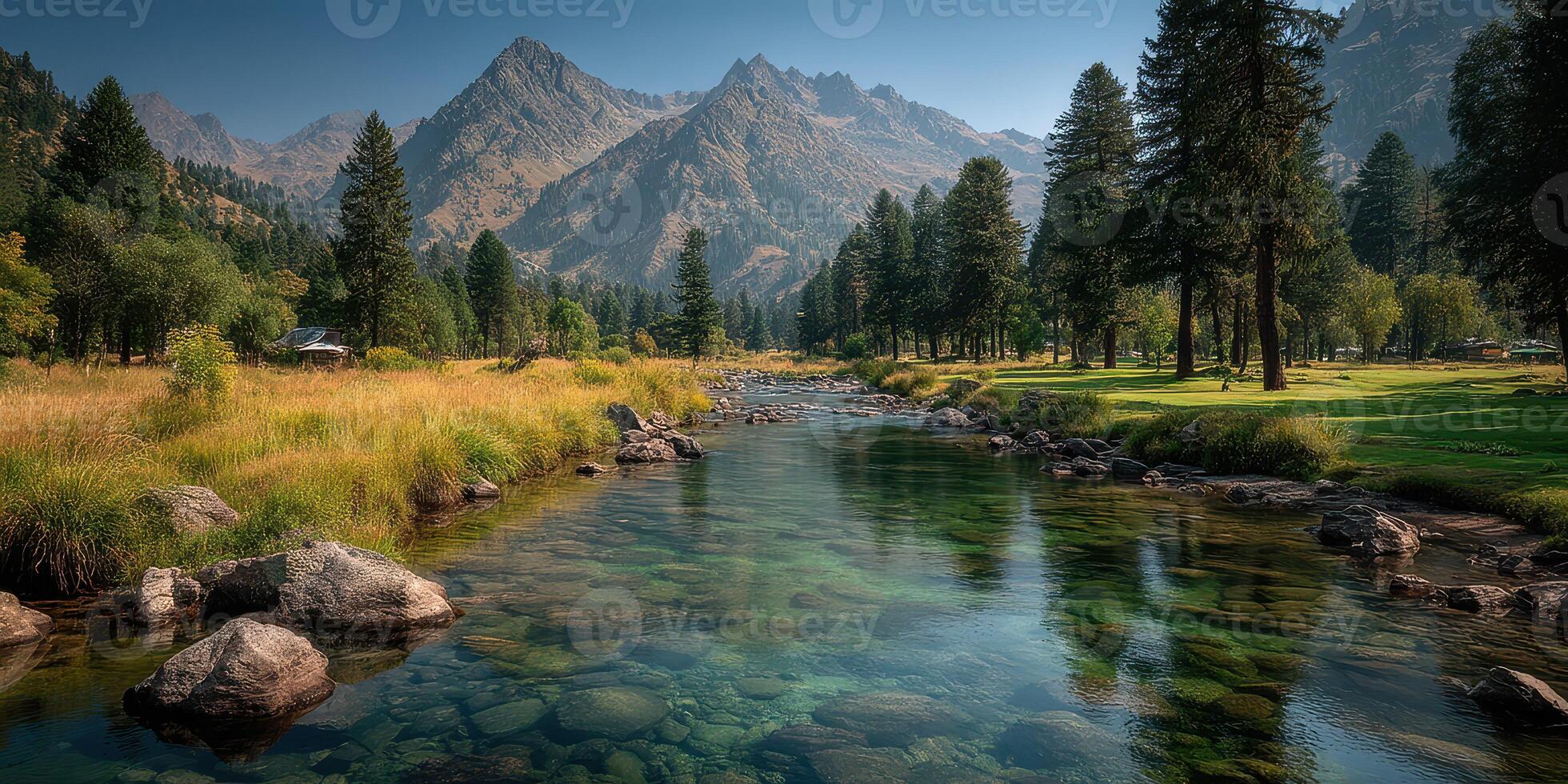 Serene mountain landscape with a clear stream and lush greenery during midday photo