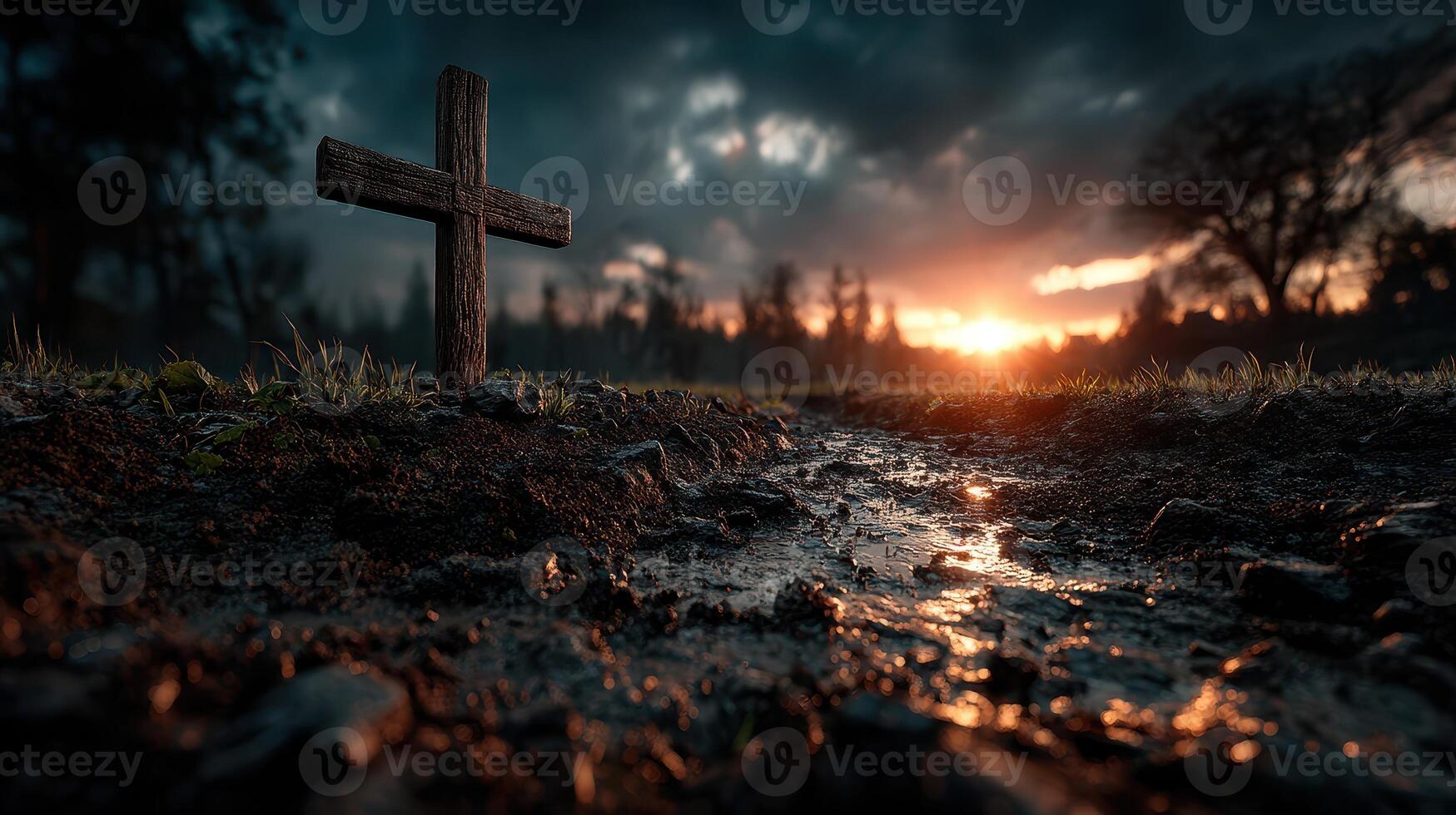 Sunset over a quiet cemetery with a wooden cross in the foreground and clouds illuminated by warm light photo
