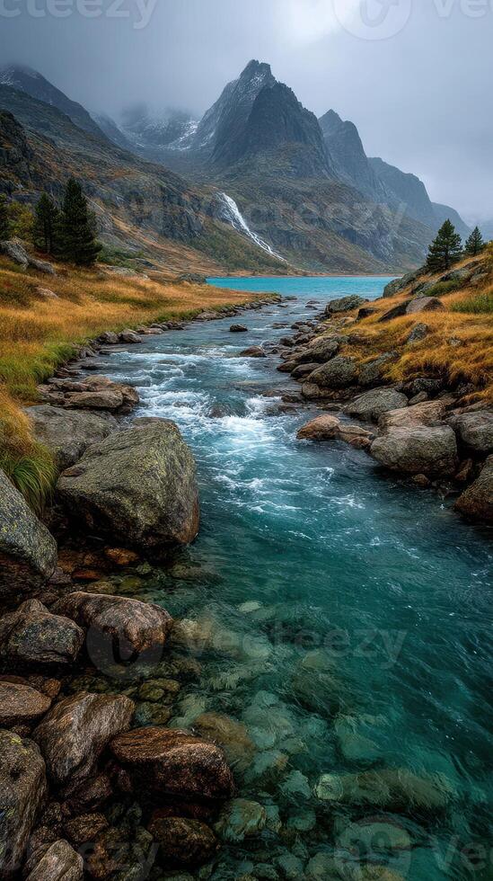 Serene river flowing through rocky landscape under cloudy skies in a mountainous region photo