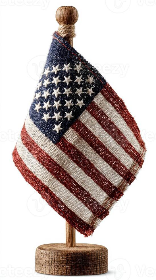 Small American flag displayed proudly on a wooden stand, symbolizing patriotism and national pride in homes or offices photo