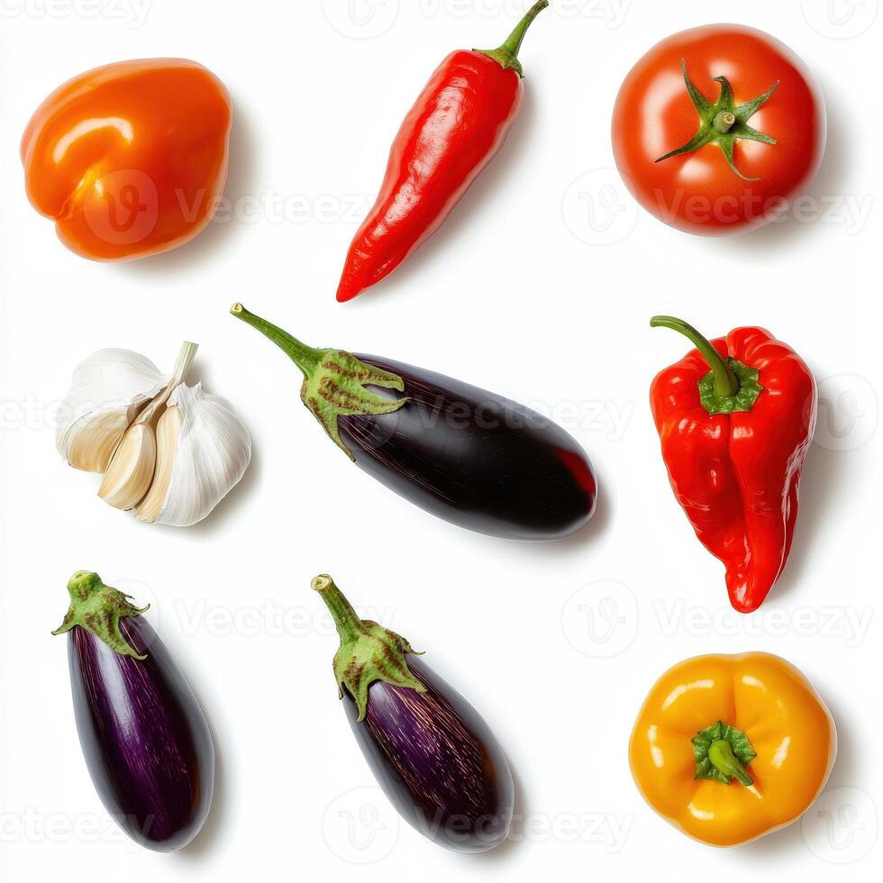 Various vegetables and peppers on a white background photo