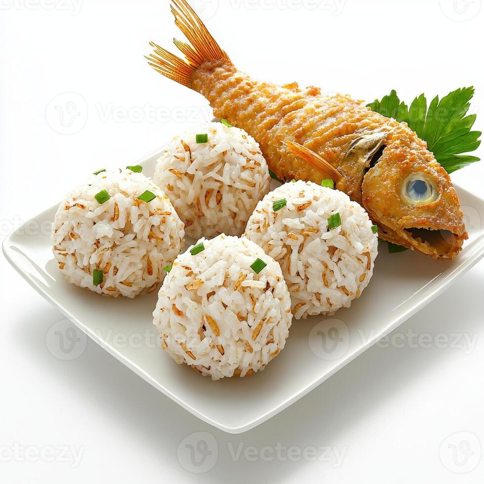 A plate of rice and fish with a green leaf photo