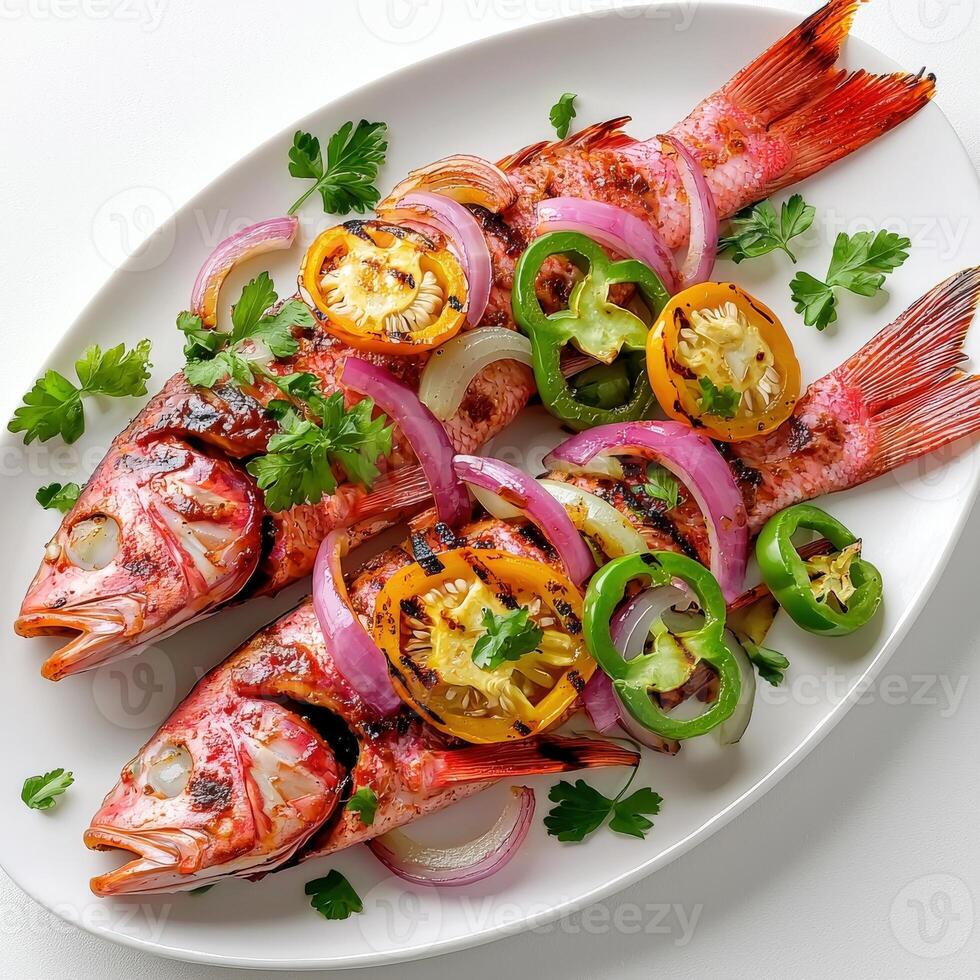 Grilled red snapper with peppers and onions photo