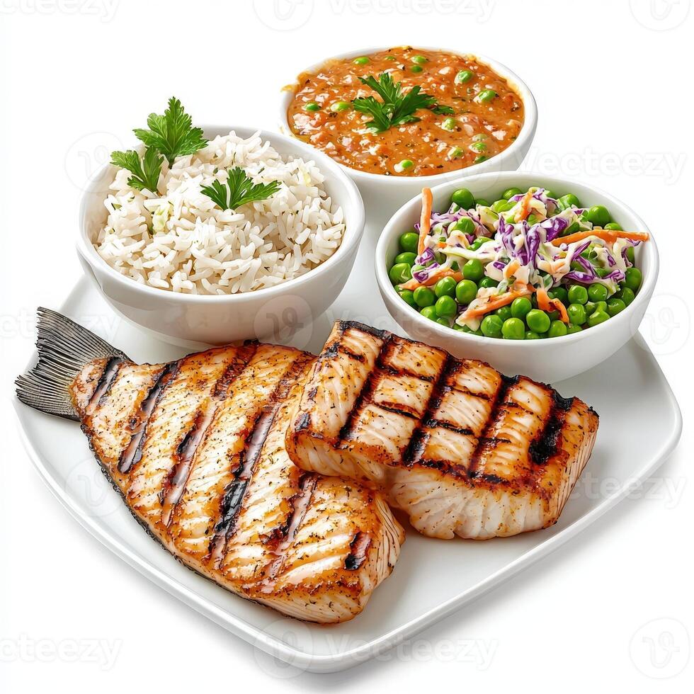 Grilled salmon, rice and peas on a white plate photo