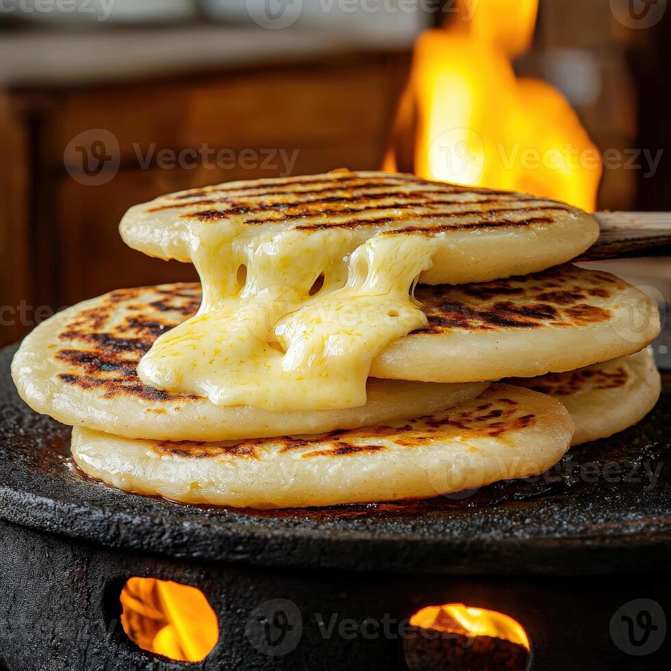 A stack of pancakes on a stove top photo
