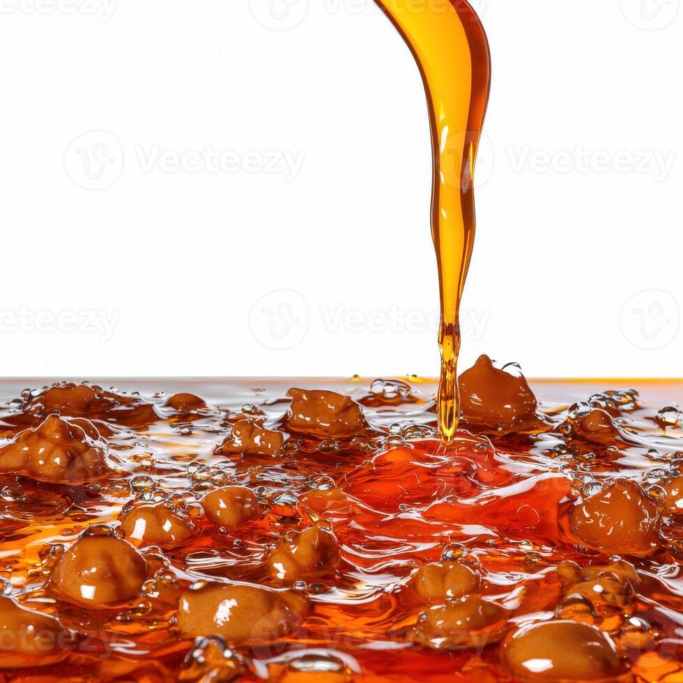 A close up of a liquid being poured into a bowl photo