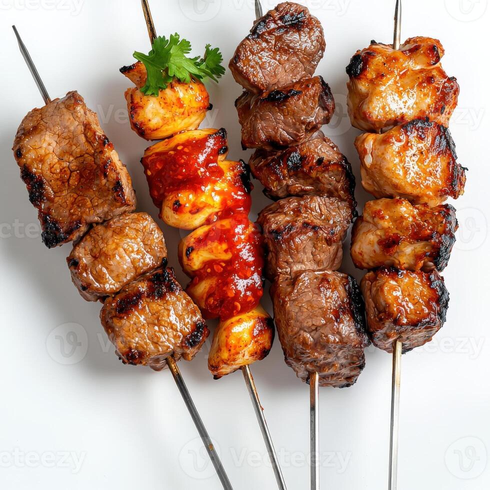 A group of skewers with meat and vegetables photo