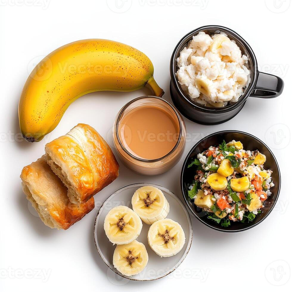 A variety of food including bananas, bread, coffee and milk photo
