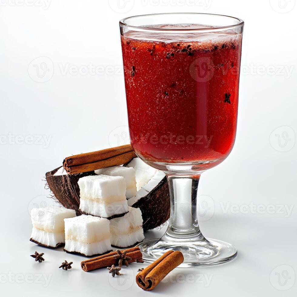 A glass of drink with marshmallows and cinnamon sticks photo
