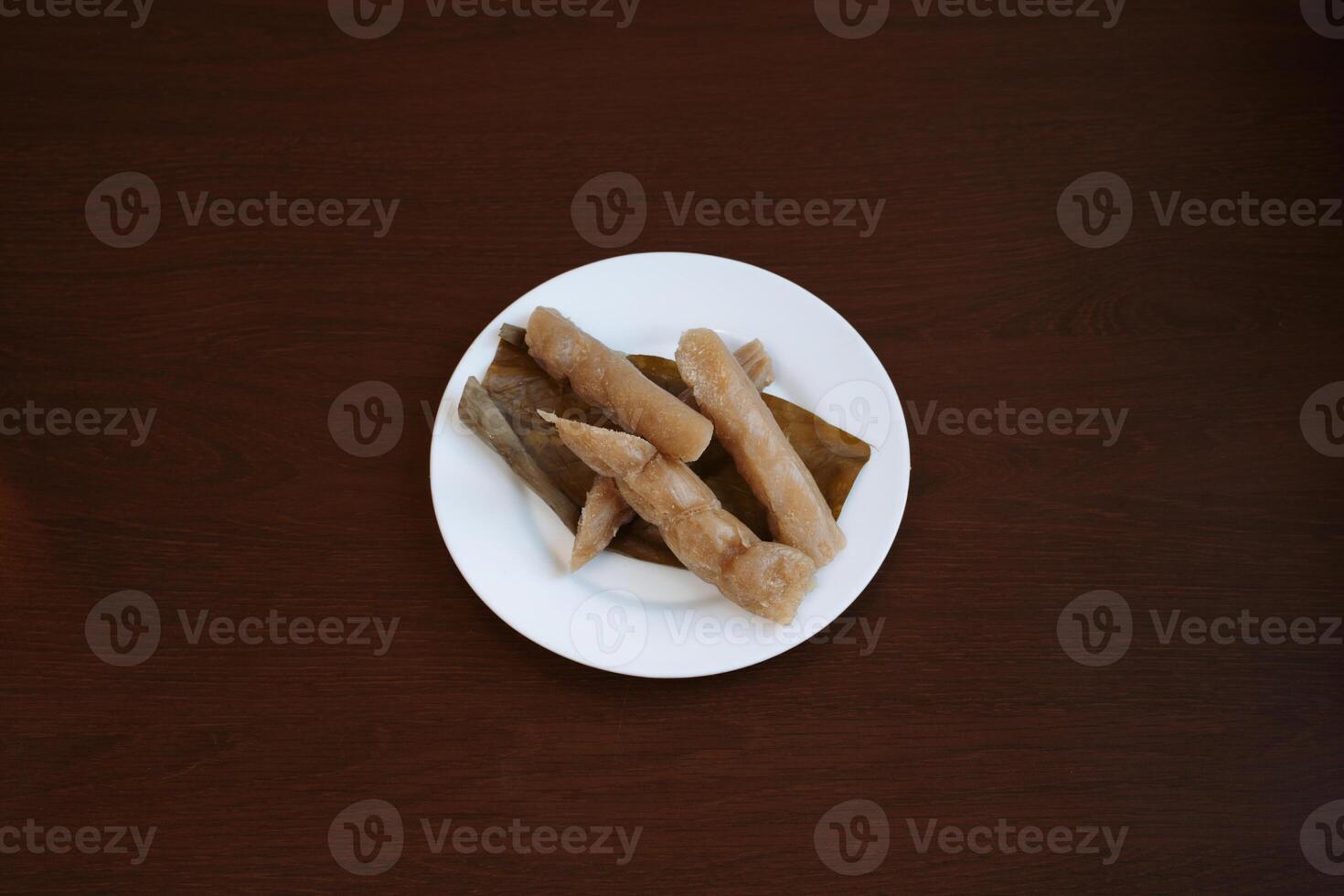 pinais suman cassava steamed in banana leaves. Delicious freshly prepared meal, perfect for menus, restaurants, or food delivery concepts. photo