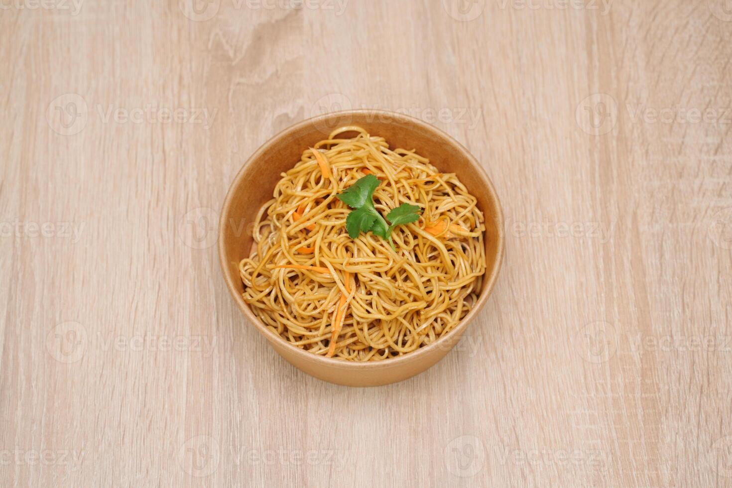 fried noodles in paper takeout container photo