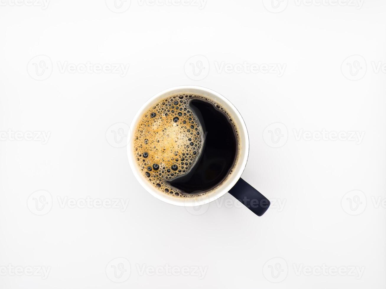 A cup of espresso coffee. View from above. Isolated on white background. Flat lay. Top view, copy space. photo