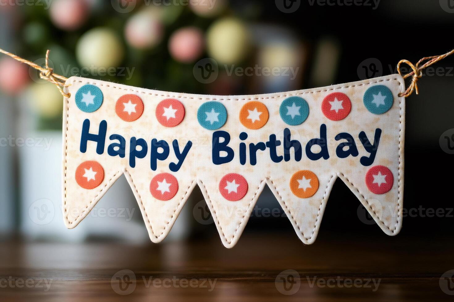 Happy birthday banner hanging with colorful dots and stars photo