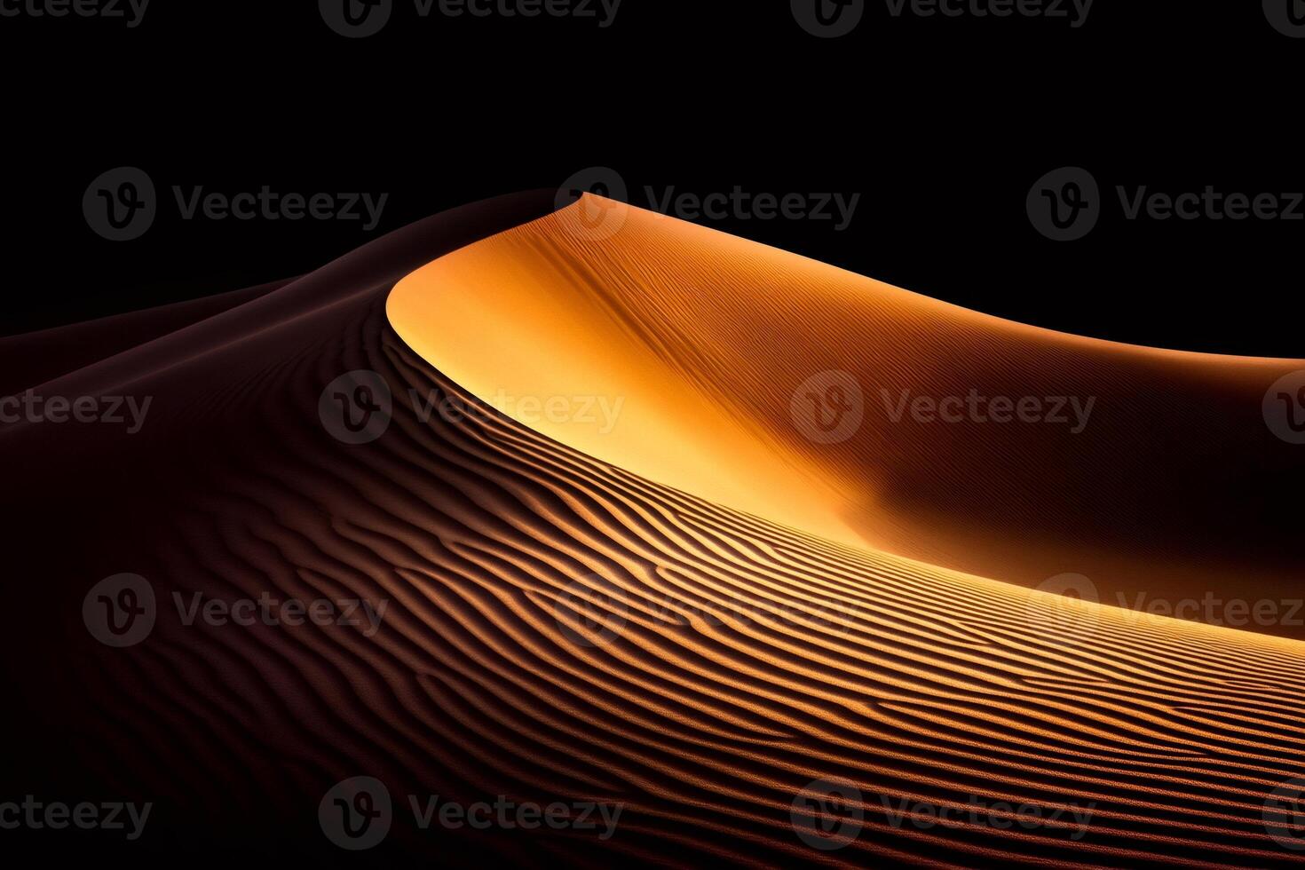 Golden sand dune illuminated by sunlight in a vast desert landscape photo