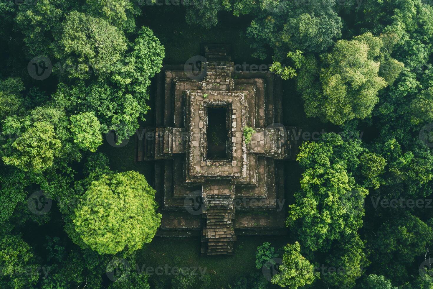 Koh ker temple emerging from lush green jungle in cambodia, aerial view photo