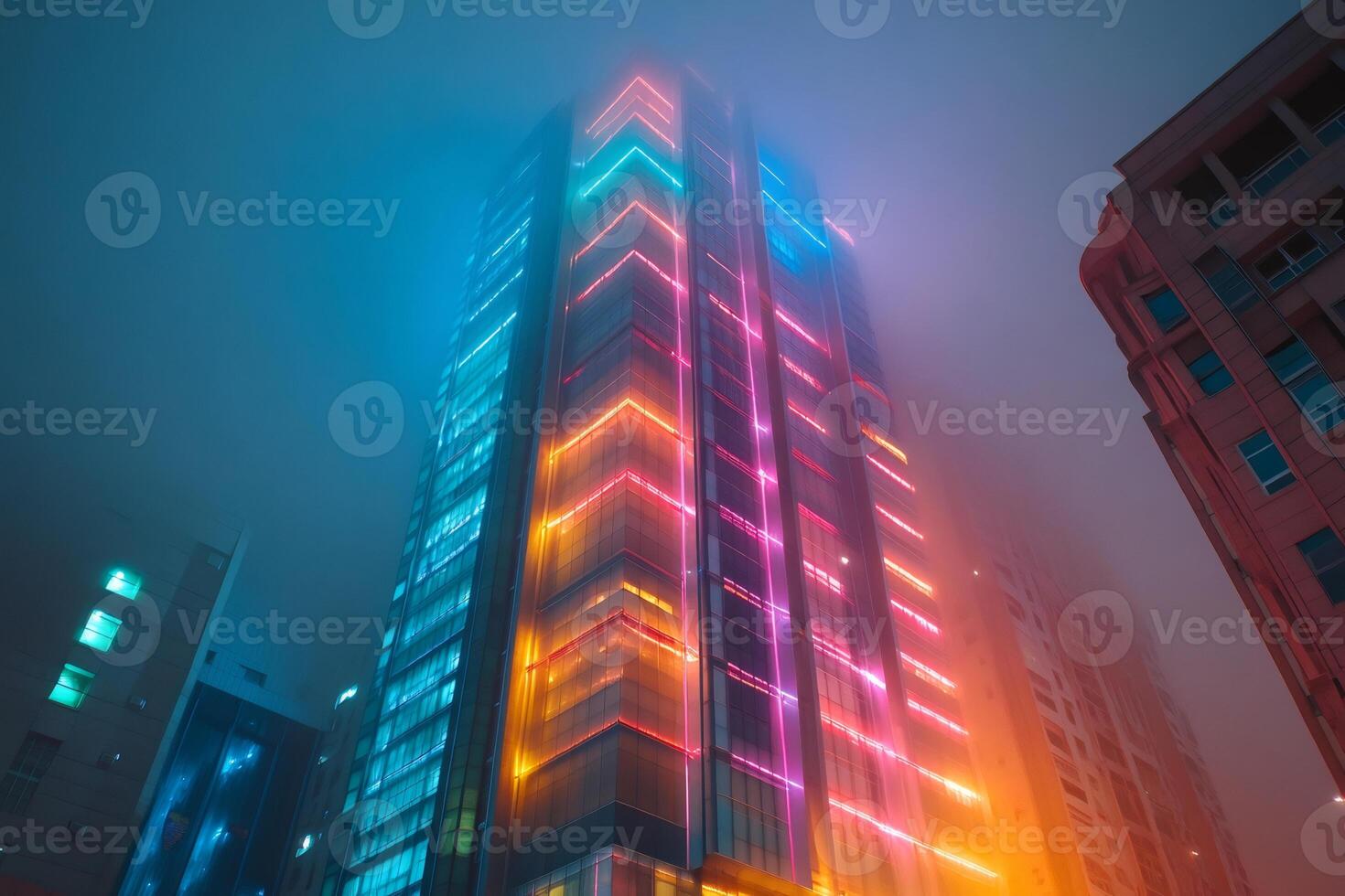 Futuristic skyscraper with neon lights illuminating foggy night photo