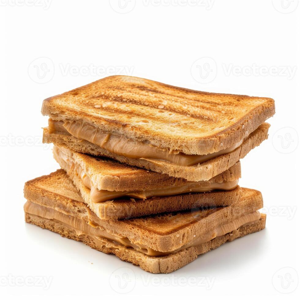 Toasted bread slices forming a peanut butter sandwich stack on white background photo