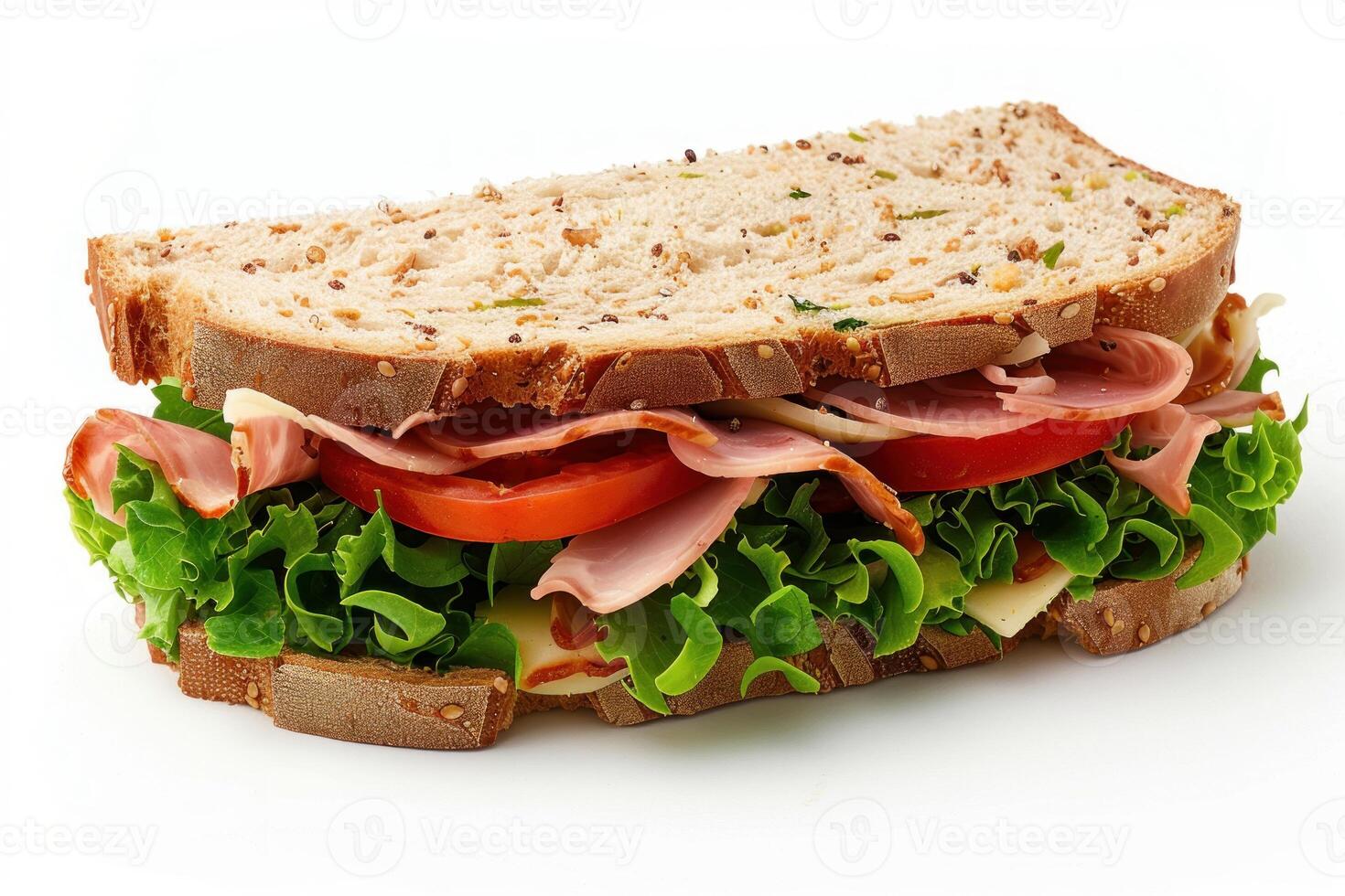 Ham and cheese sandwich with lettuce and tomato on whole wheat bread photo