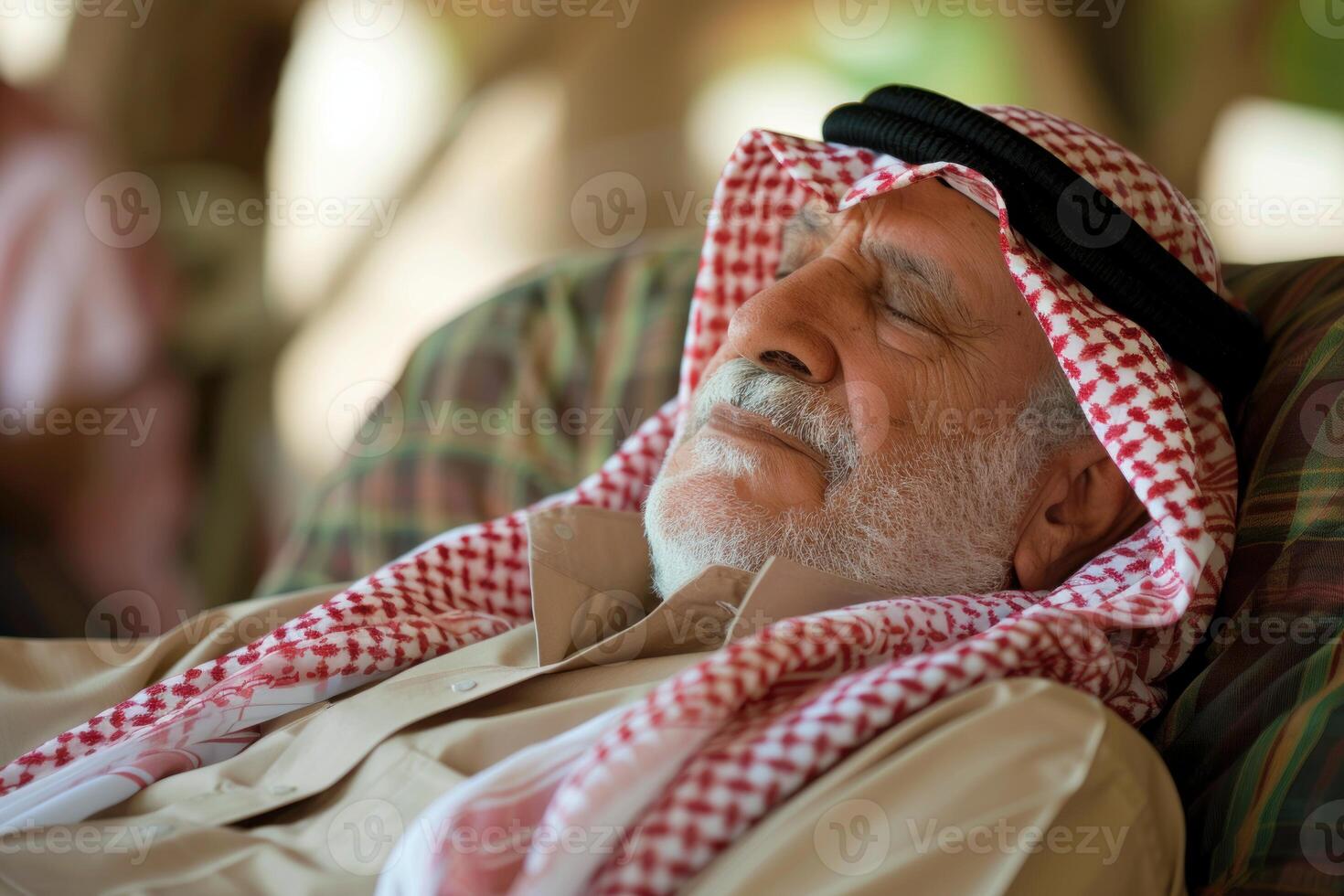 Senior arab man sleeping peacefully on comfortable sofa photo