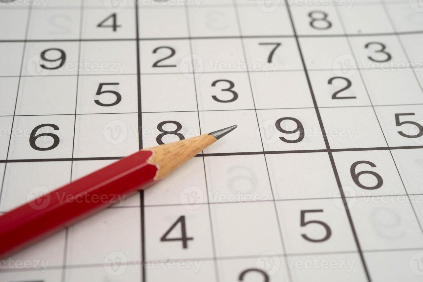 Puzzle game paper with pencil photo