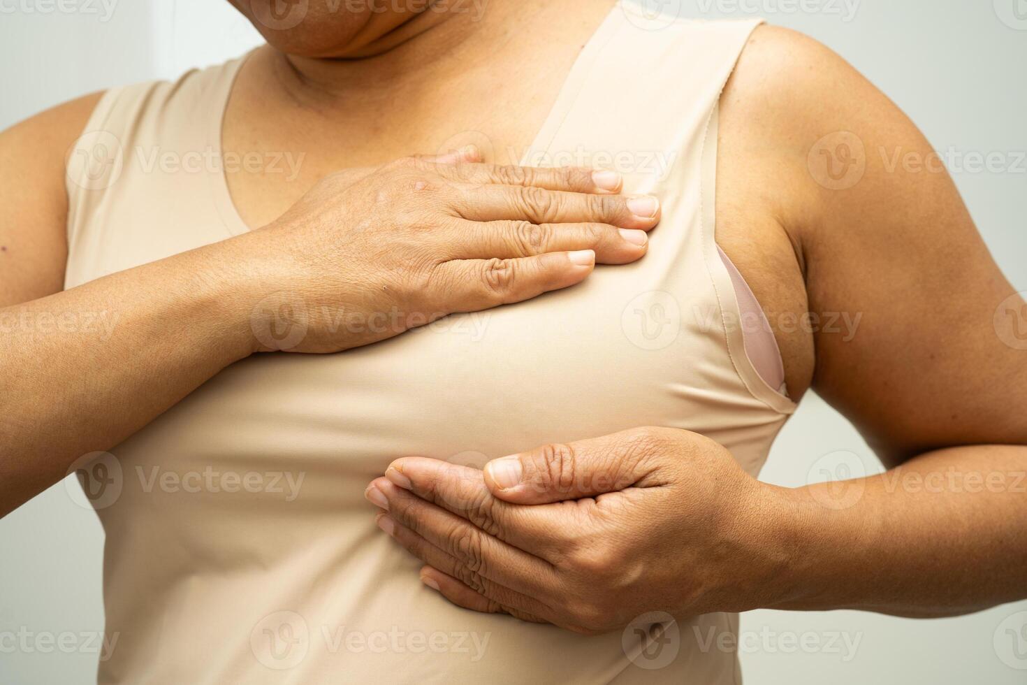 woman self touching check lump or Breast cancer photo