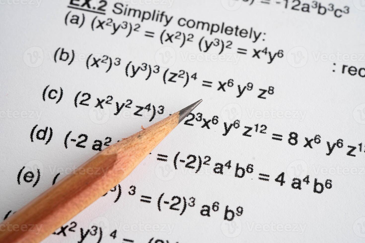 Pencil on mathematic formula exercise test paper photo