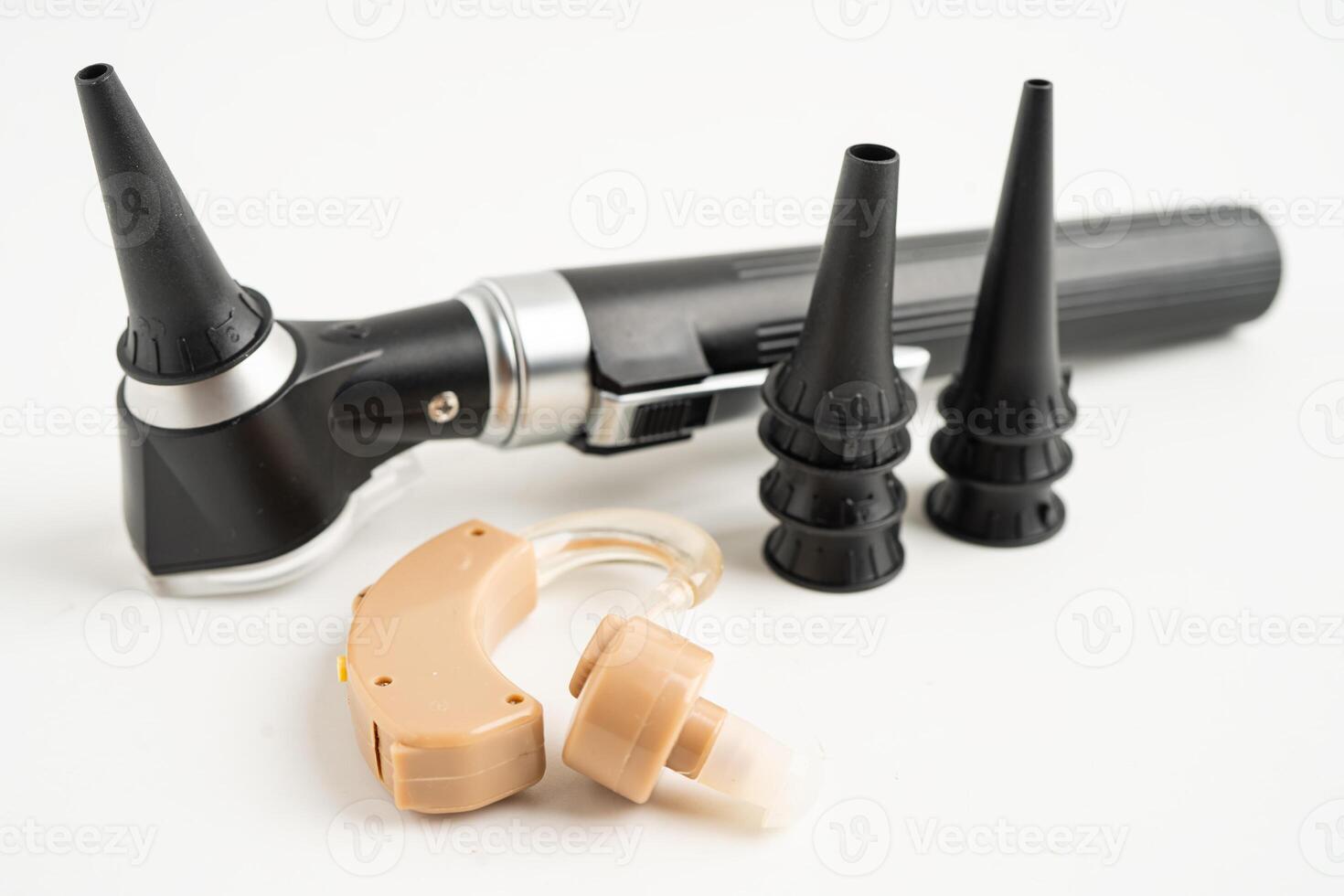 Otoscope isolated on white background for otolaryngologist or ENT physician doctor examining senior ear photo