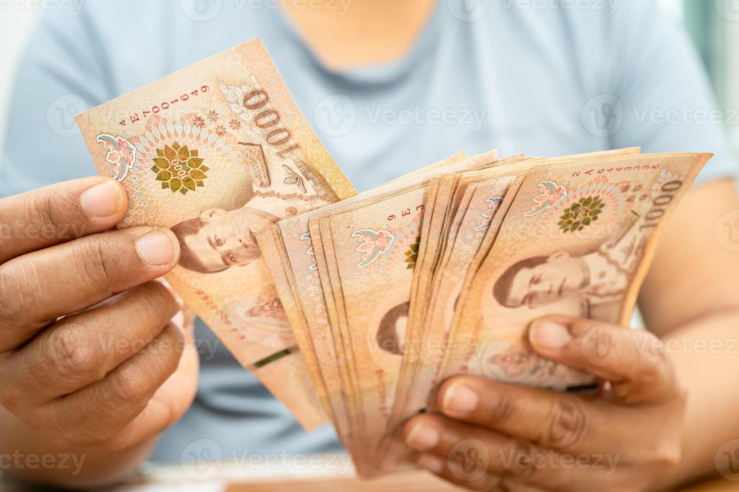 Asian woman counting Thai baht banknote money, investment economy, accounting business and banking. photo