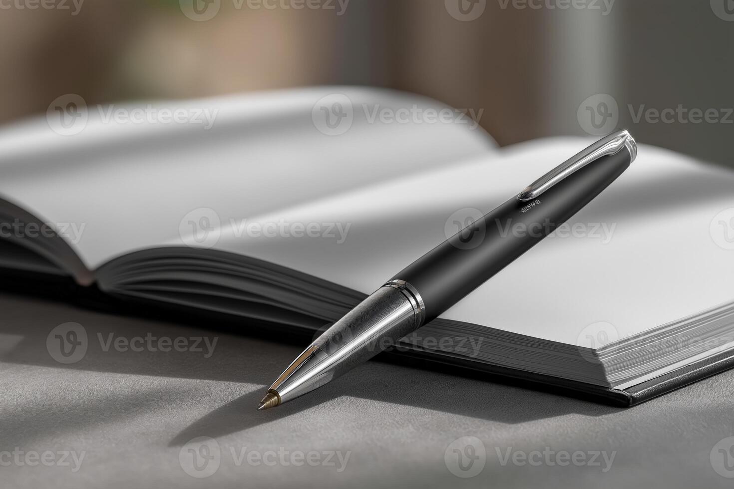 Elegant Black Pen on Open Notebook in Soft Light photo