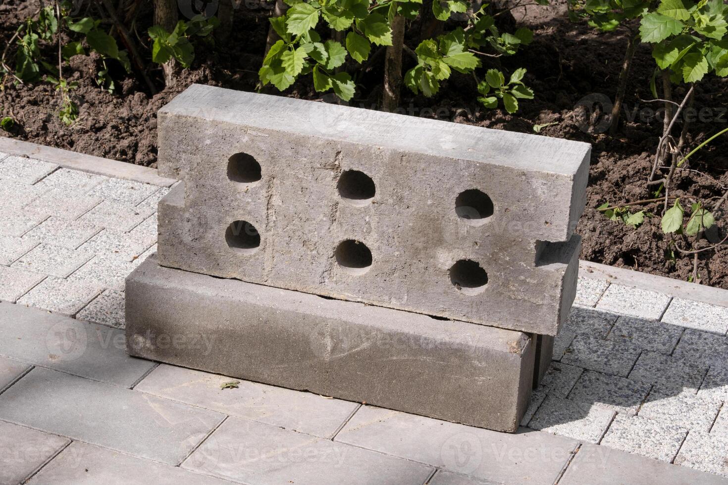 building blocks for paving a sidewalk on a sunny day photo