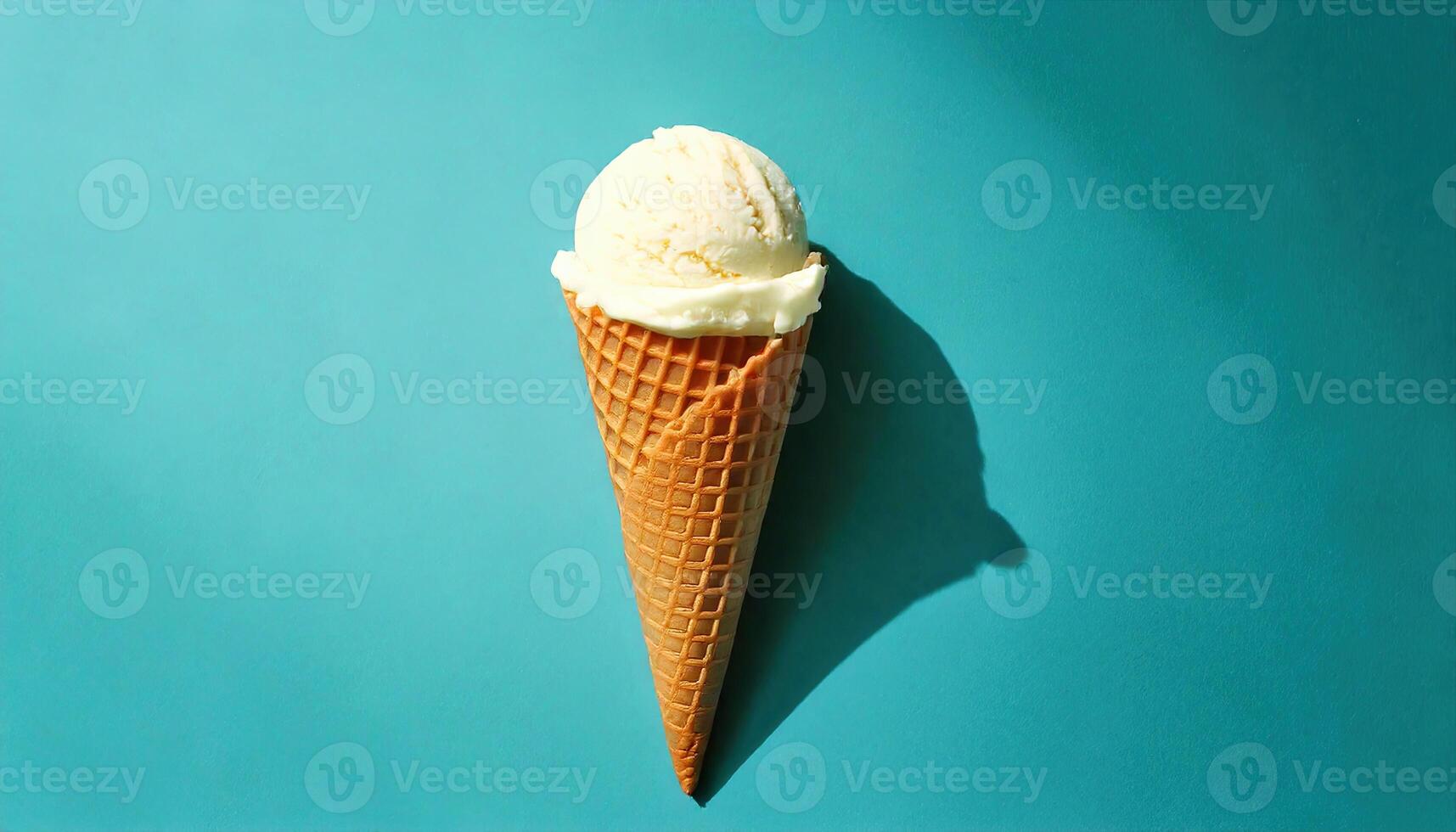 Classic ice cream cone on the blue background photo